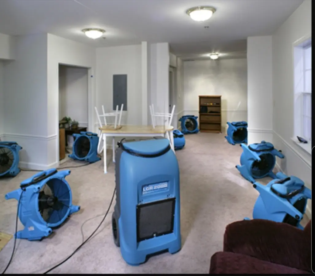 Air movers and dehumidifier setup for Water Damage Restoration in Camp Swift